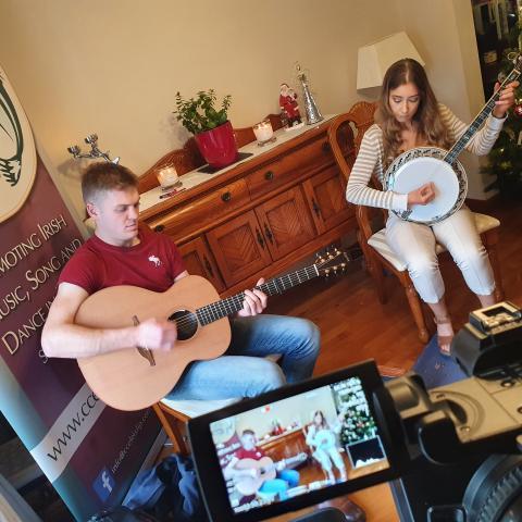 Image of 2 musicians being recorded